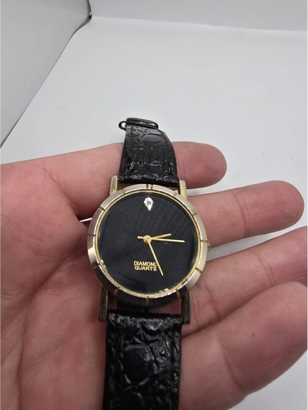 Generation Diamond Quartz Analog Watch Black Dial Gold Tone Black Leather Strap